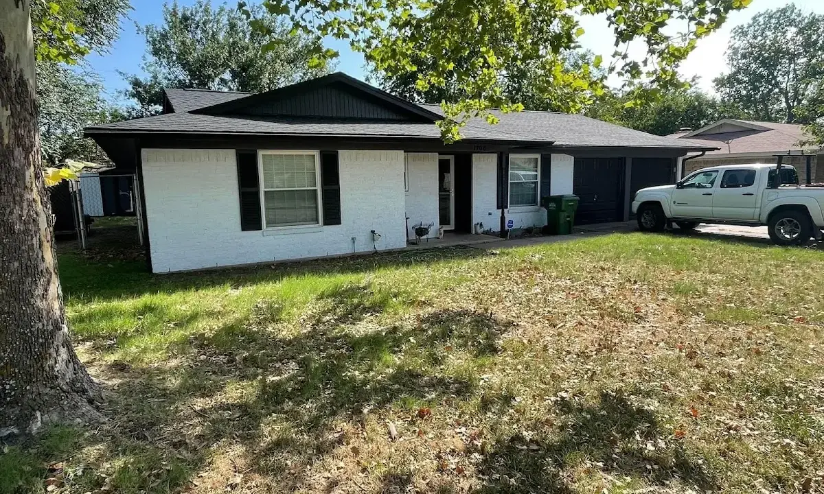 Professional roofing crew working on a residential roof in Carrboro